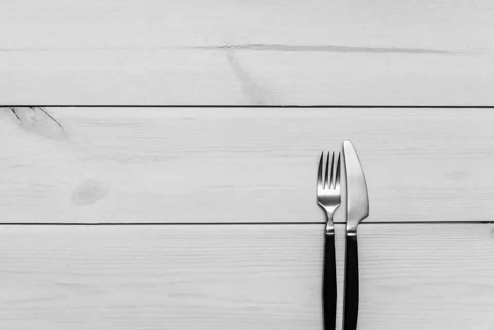 A quiet kitchen table prepared for reviewing personal notes